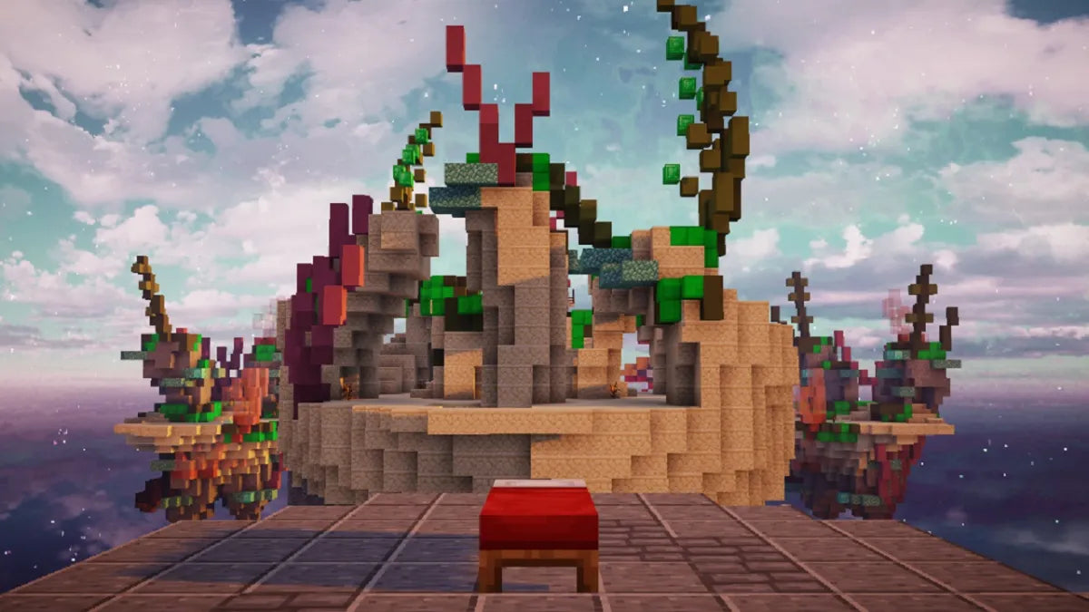 A Minecraft screenshot showing a sandy island structure with colorful coral-like builds floating against a cloudy sky.