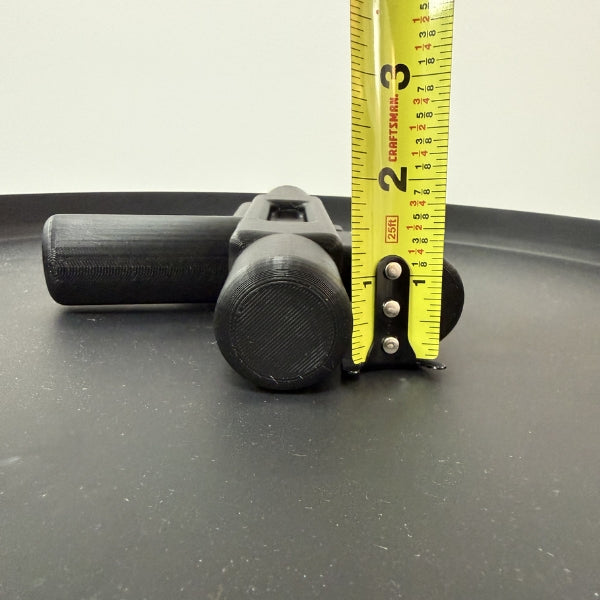 Side view of brick style blaster replica with tape measure showing the height of the 3D printed prop.