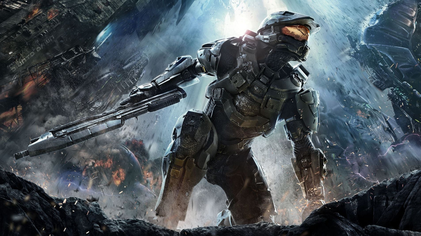 Dynamic action artwork of Master Chief from Halo standing on rocky terrain with a rifle in hand, surrounded by explosions, debris, and massive alien structures in a chaotic sci-fi battlefield.