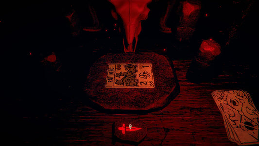 Rat king card on a table in a dark room