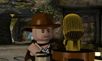 LEGO Indiana Jones character holding a whip in an adventure scene.