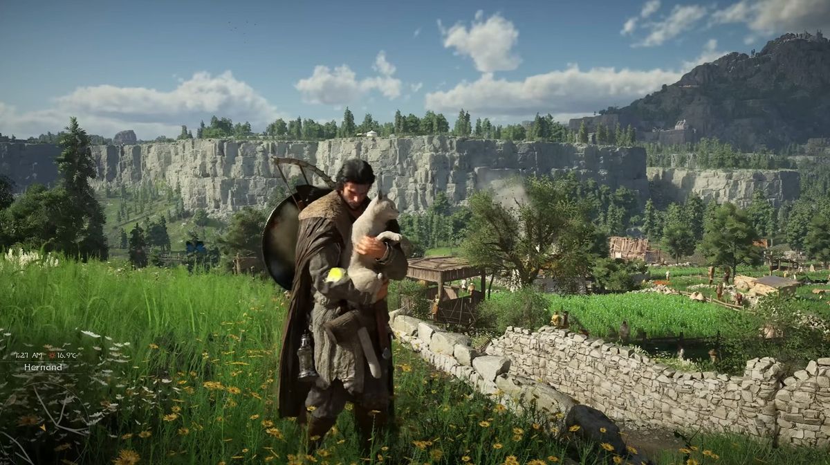 A medieval adventurer carrying a lamb walks through a grassy hillside overlooking a village with stone walls, fields, and cliffs in the distance.