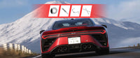 Red sports car driving on a mountain road with snowy peaks in the background, alongside tuning and suspension upgrade icons displayed above.