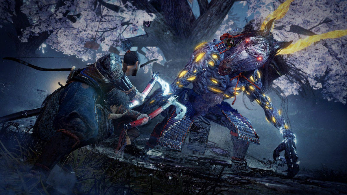 Nioh 2 gameplay screenshot showing samurai fighting glowing yokai enemy in dark forest environment