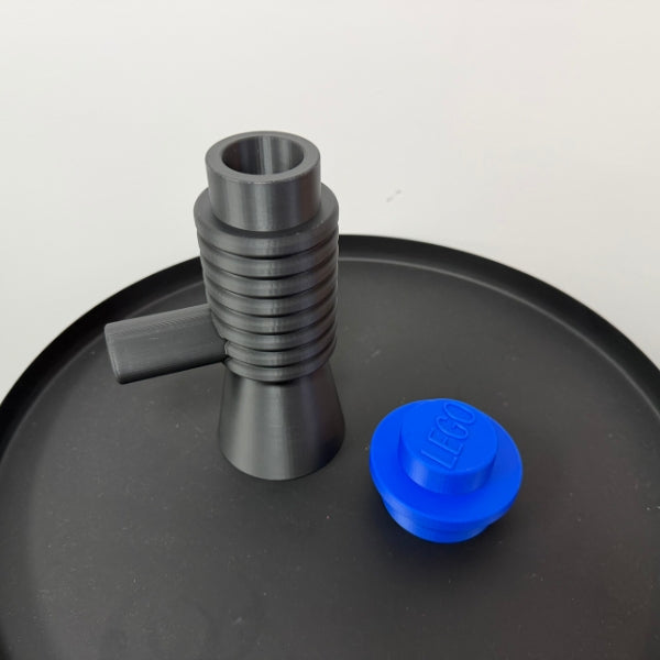 Brick style megaphone blaster replica with removable top piece separated from the main body.