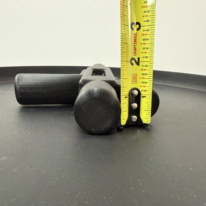 Side view of brick style blaster replica with tape measure showing the height of the 3D printed prop.