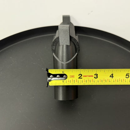 Front view of brick style revolver replica with tape measure showing barrel width.