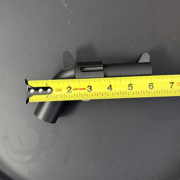 Brick style revolver replica with tape measure measuring full length of the prop.