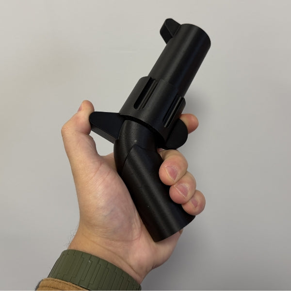 Black brick style revolver replica close up showing the cylinder and barrel of the 3D printed prop.