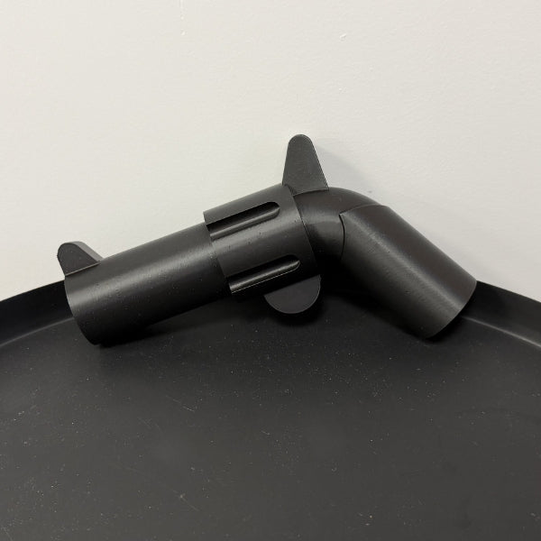 Brick style revolver replica displayed on table showing the block inspired design.