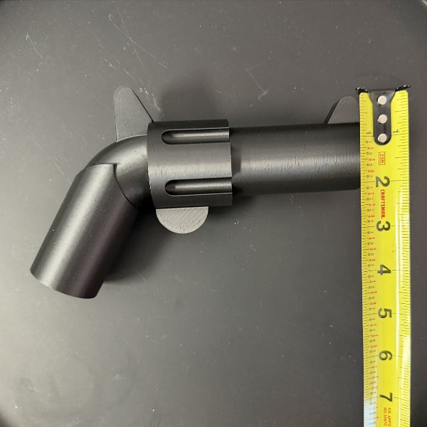 Brick style revolver replica with tape measure showing height of the 3D printed prop.