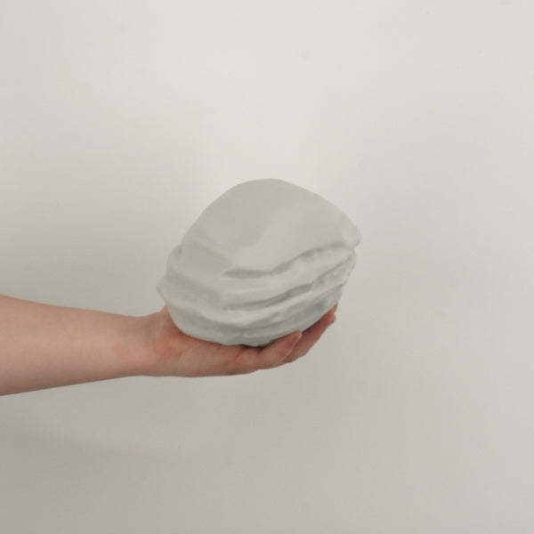 Rust Starter Rock replica held in hand showing the size of the 3D printed gaming prop.