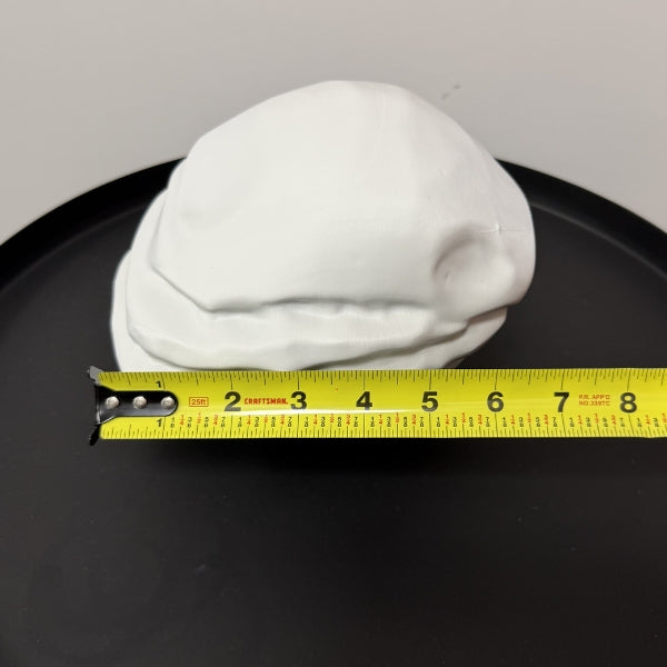 Rust Starter Rock replica with tape measure showing the width of the life size 3D printed prop.