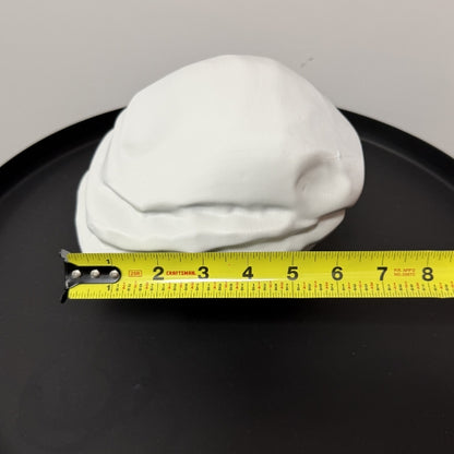 Rust Starter Rock replica with tape measure showing the width of the life size 3D printed prop.