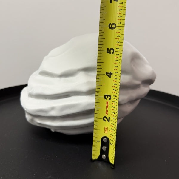 Rust Starter Rock replica with tape measure showing the height of the life size 3D printed prop.